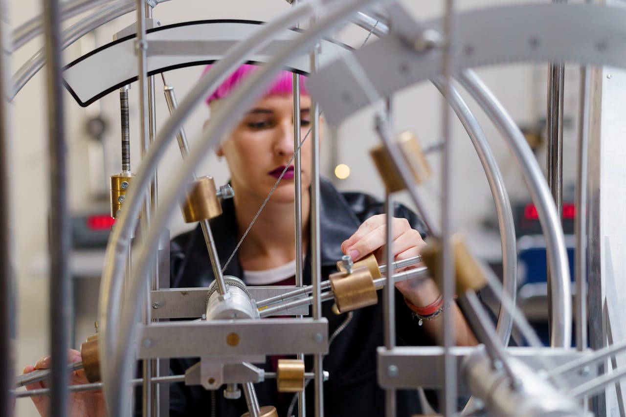 services-02 A focused young female scientist adjusts equipment in a lab setting.