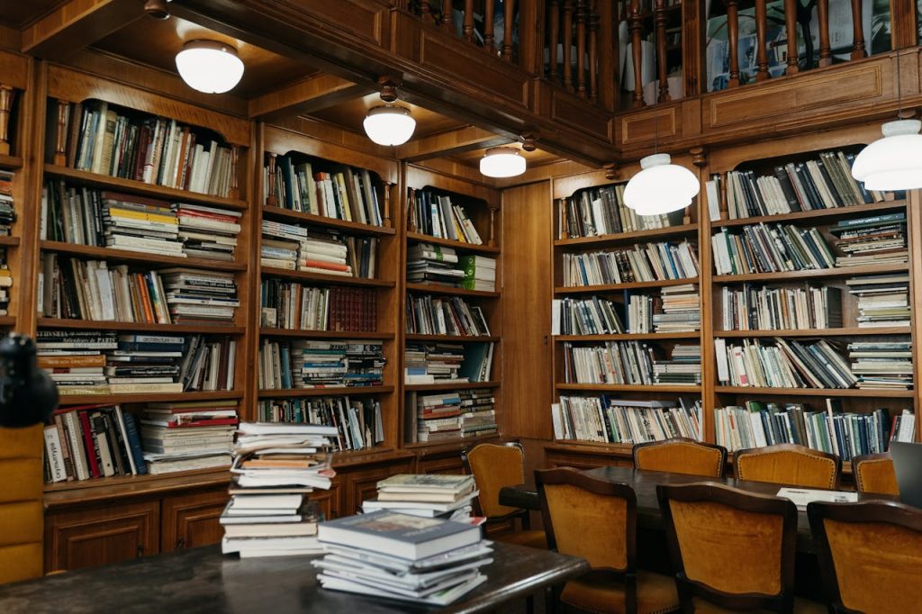 pexels photo 9572619 Warm wooden library with stacked bookshelves, perfect for reading enthusiasts.